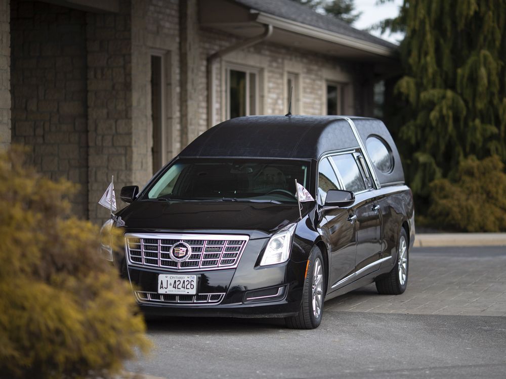 a hearse is parked outside families first funeral home on dougall avenue on jan. 14, 2020. covid-19 has become the most common cause of death in windsor and essex county.