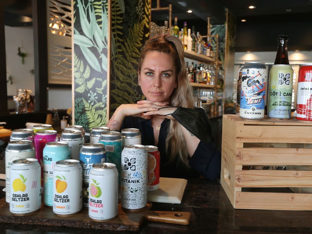 stephanie gervais, owner of astoria bistro botanique in gatineau, poses for a photo wednesday. stephanie is conflicted because she knows it's in the public good to have vax passports, but she anticipates blowback.