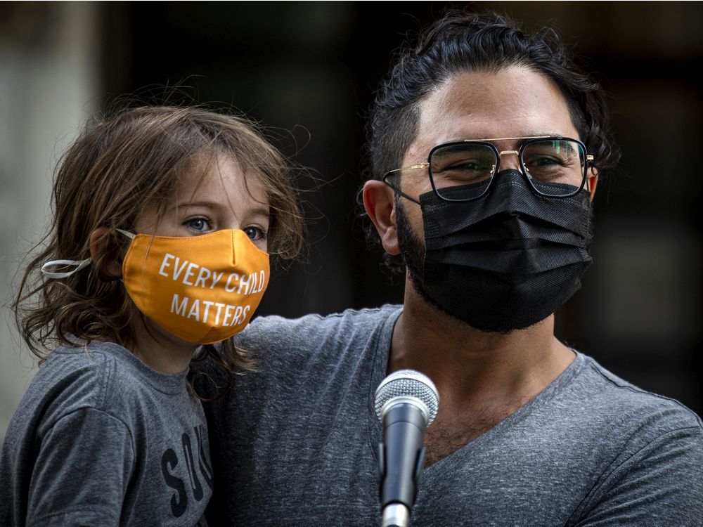 kiavash najafi held three-year-old navid najafi at sunday's safety-palooza as he addressed his fears about his children being vulnerable with a newborn and a child going to school this fall.