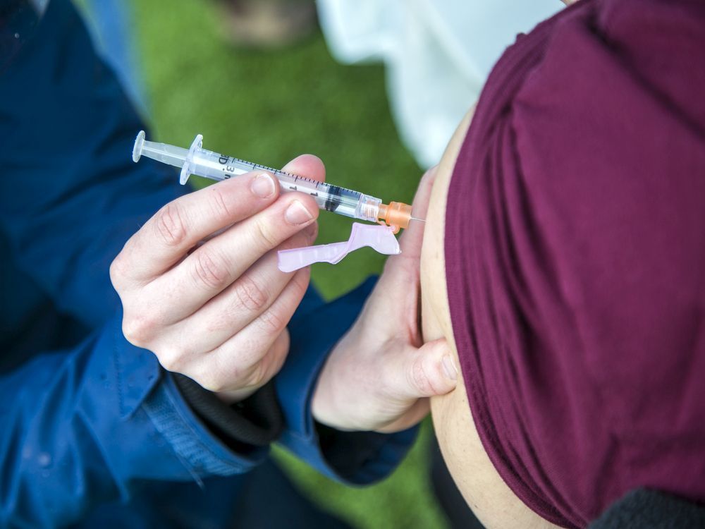 a file photo from an ottawa covid-19 vaccination clinic in early may.