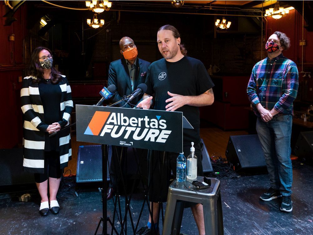 nicole goehring, ndp culture critic, left, david shepherd, ndp health critic, tyson boyd, owner and operator of the starlite room, and rob browatzke, co-owner of evolution wonderlounge, call for a vaccine passport system to allow event venues to survive the covid-19 pandemic during a news conference at the starlite room in edmonton, on tuesday, sept. 7, 2021.