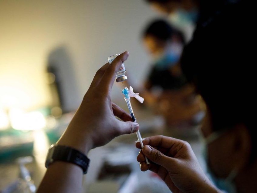 in this file photo nurse kevin sagun with humber river hospital draws a dose of the moderna covid-19 vaccine before administering it at a loft community housing complex in toronto, ontario, canada, march 26, 2021.