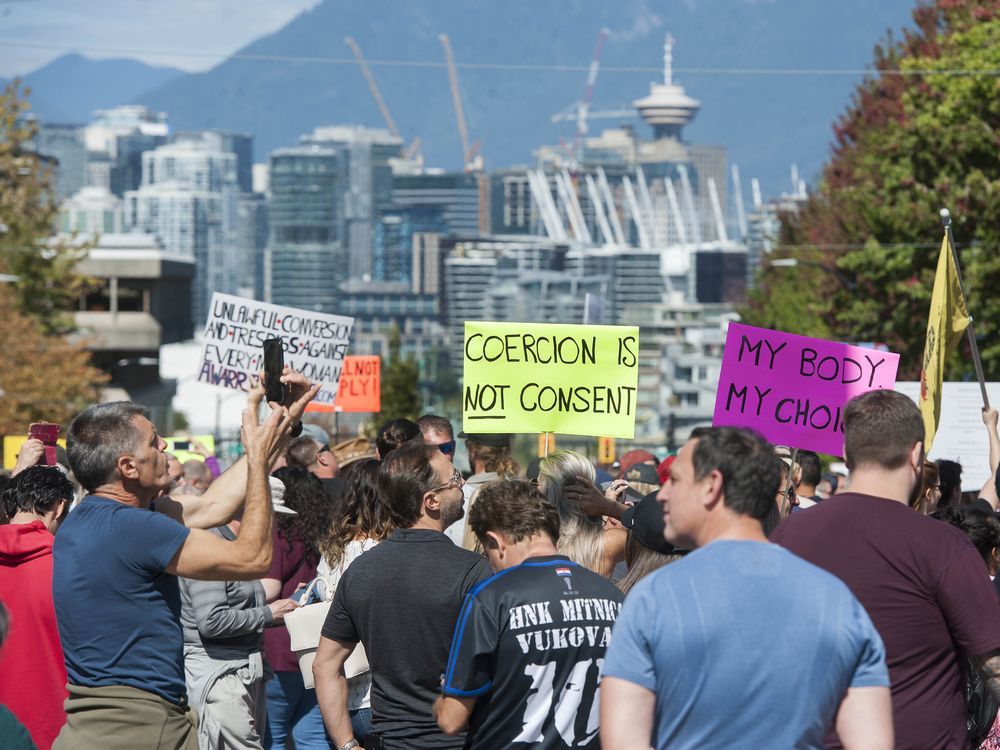 thousands of people unhappy over the b.c. vaccine pass and other covid-19 restrictions protested outside vancouver general hospital and vancouver city hall on wednesday.