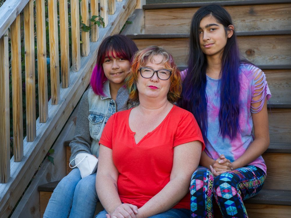 Kyenta Martins with her daughters Cate and Zoe at their home in Vancouver. Mom plans on calling in sick for 10-year-old Cate because she's scared to go back to school for fear of bringing home COVID to her mom.