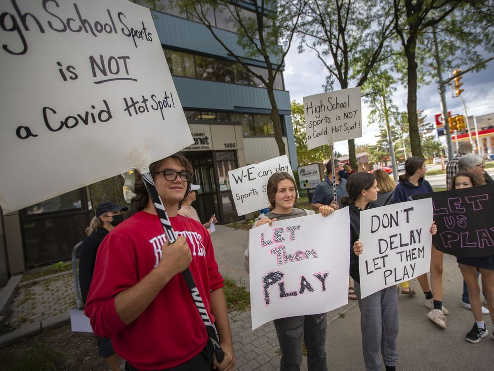 parents, coaches, and students opposed to the local health unit's recommended postponement of extracurricular activities, protest outside the windsor-essex county health unit on ouellette avenue, on thursday, sept. 9, 2021.