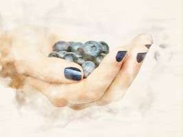 hand with blueberries