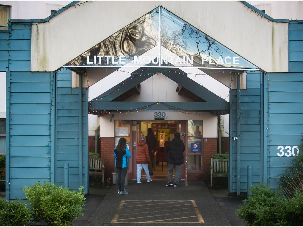 people wait to be screened before entering little mountain place, a long-term care home that has had 38 residents die since a covid-19 outbreak was declared at the facility in november, in vancouver, on sunday, january 3, 2021.