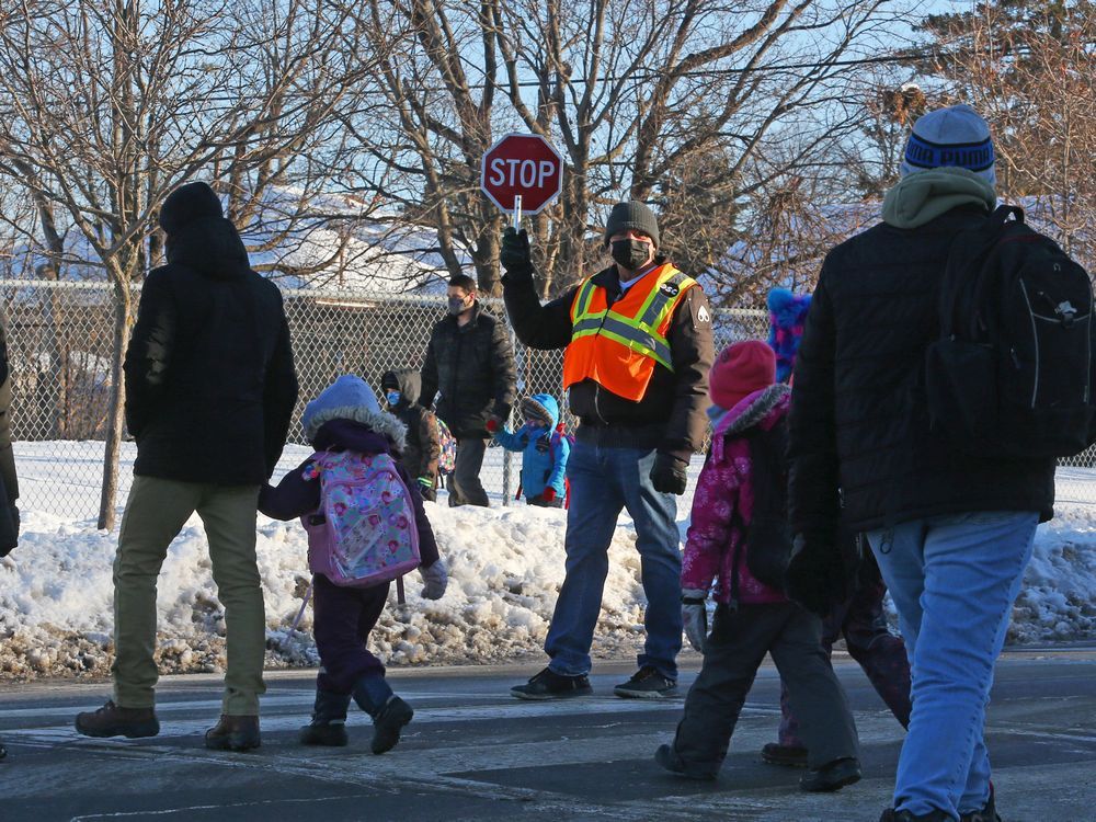 students get ready to start the school day in this winter 2021 photos. how many school closures could have been prevented if parents did not have to choose between losing their wages and sending their child with yet another runny nose to school?