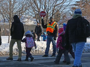 Students get ready to start the school day in this winter 2021 photos. How many school closures could have been prevented if parents did not have to choose between losing their wages and sending their child with yet another runny nose to school?