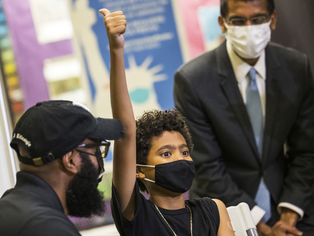 Mason Lawrence, 9, gives a thumbs-up after receiving a COVID-19 vaccination at a pop-up site in New York City on Nov. 8. The vaccine was cleared for children ages 5-11 in the United States in early November.