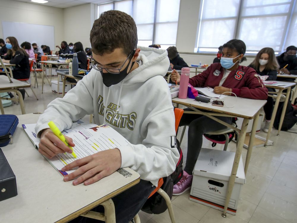 Masked students work at their desks during French class at John F. Kennedy High School in Montreal Tuesday November 10, 2020.