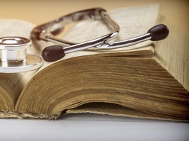 vintage photo of old book and stethoscope