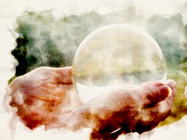 close-up of womans hand holding a shiny glass sphere in watercolors