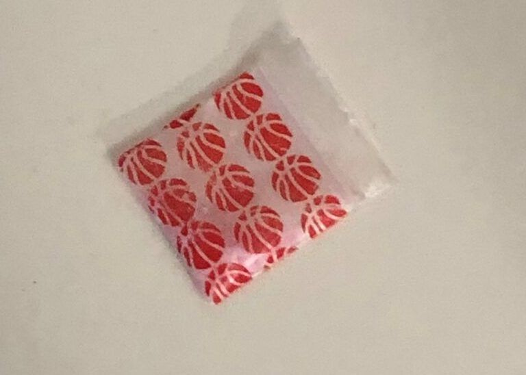 an image released by toronto police of a package of a suspicious drug believed to have caused two fatal overdoses.