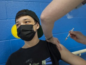 Daron Smith, 20, gets his COVID-19 vaccination while at a walk-in pop-up vaccination clinic at the Windsor Essex Community Health Clinic on Monday, May 17, 2021.