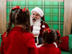 Children prepare to pose for a photo with Santa at the Willow Grove Park Mall ahead of Christmas in Willow Grove, Pennsylvania.