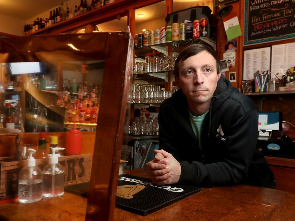 Mike Estabrooks, owner of Irene's Pub, poses for a photo at his bar on Bank Street.