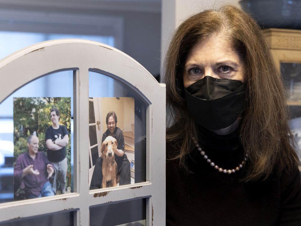 Lynda Hoffman holds a frame with a picture of her son, Aaron Kaufman, right, who died of legionnaires' disease.