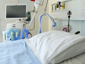 FILE: A ventilator stands beside a bed in the regional intensive care unit at Belleville General Hospital.