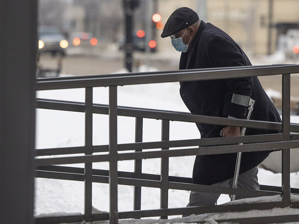 Former Regina doctor Sylvester Ukabam, 76, who has been accused of sexually assaulting five of his former patients, is seen walking into Court of Queen's Bench on Jan. 12.