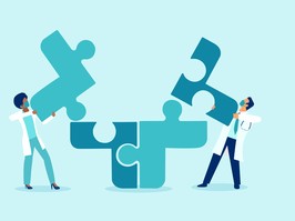 Vector of two doctors putting puzzle pieces together a symbol of team work and collaboration