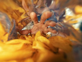 hand take potato chips out of bag. I developed a mild cough that lasted about a day, as well as a weird insatiable urge for salt and vinegar chips.