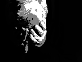 Depressed elderly man alone in the dark