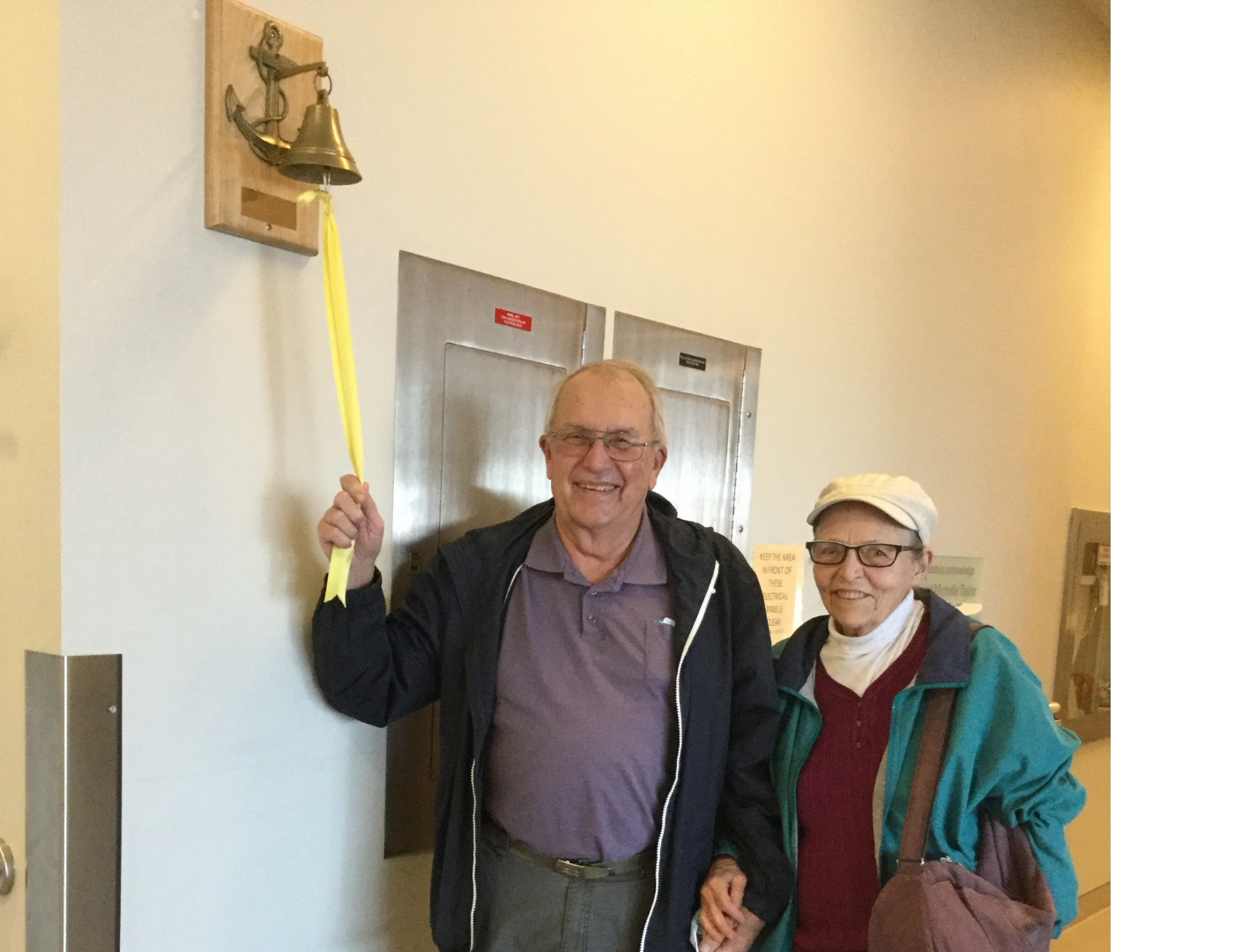 Peter Brown ringing the bell at Irving Greenberg Family Cancer Centre, to mark the end of his treatment.
