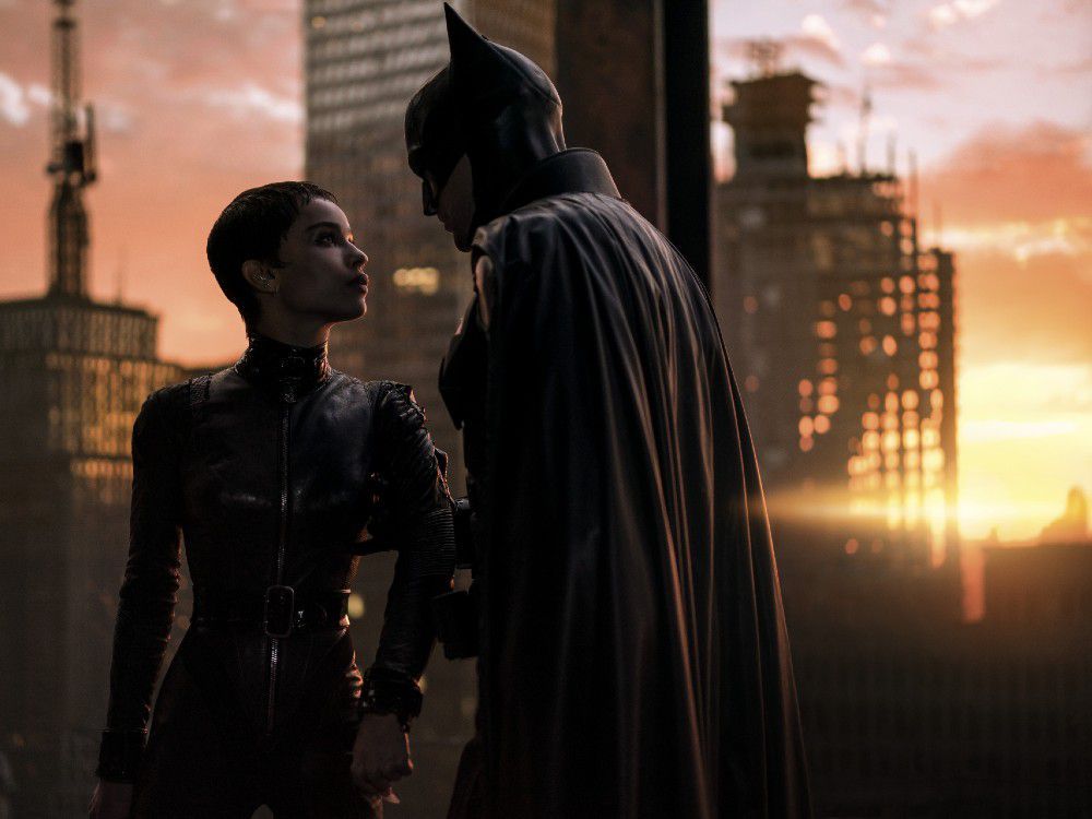 Zoë Kravitz as Selina Kyle and Robert Pattinson as Batman in the Warner Bros. Pictures’ action adventure The Batman.