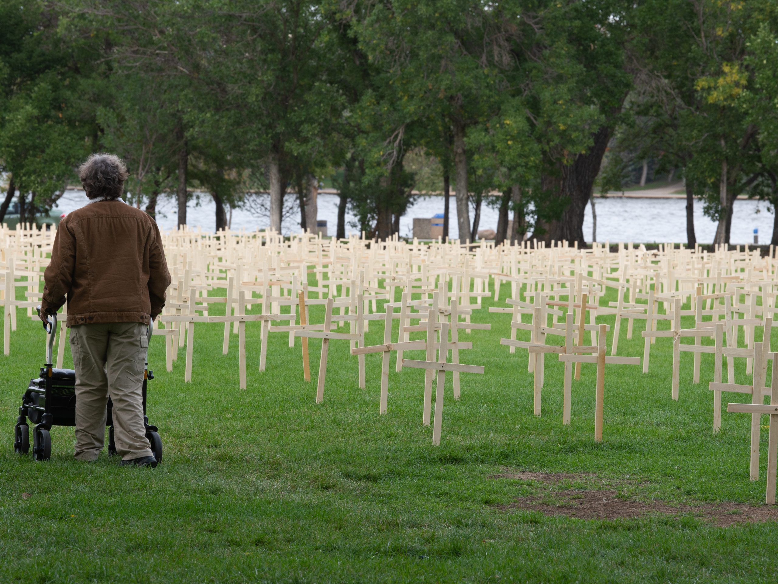 row upon row of wooden crosses meant to represent the lives lost in saskatchewan to drug overdoses.