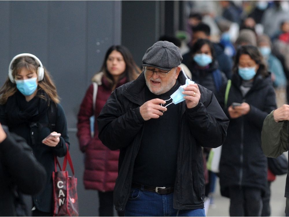 crowds of people wearing and not wearing masks on march 10 in vancouver.