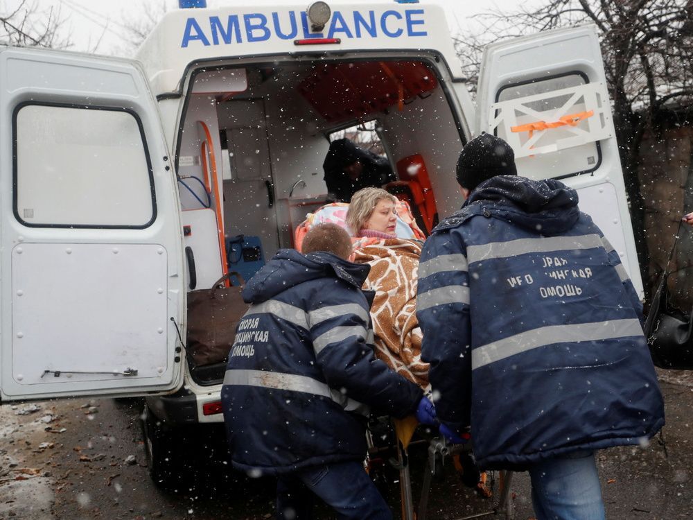 medical specialists transport an injured woman to an ambulance following recent shelling in the separatist-controlled city of donetsk, ukraine, on march 3, 2022.