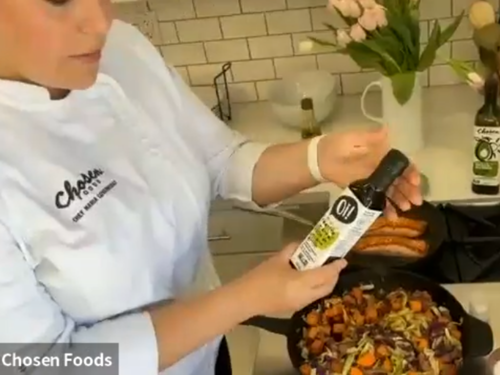 chef maria covarrubias of chosen foods prepares salmon over sesame roasted veggies using avocado oil.