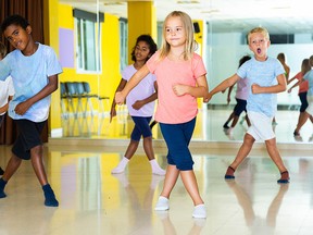 Active young children posing at dance class