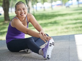 Vietnamese bald woman doing exercising outdoors