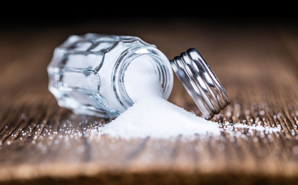 sodium is an electrolyte, which helps regulate the amount of water in and around your cells. GETTY