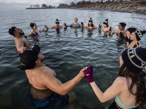 People in Lake Ontario for cold water therapy