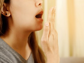 woman checking her bad breath