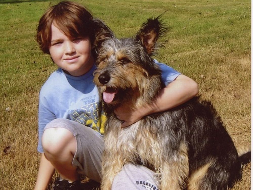 Justin Ernst shown with his dog, Muffie. Justin died on Dec. 14, 2010 at age 13 from cancer.