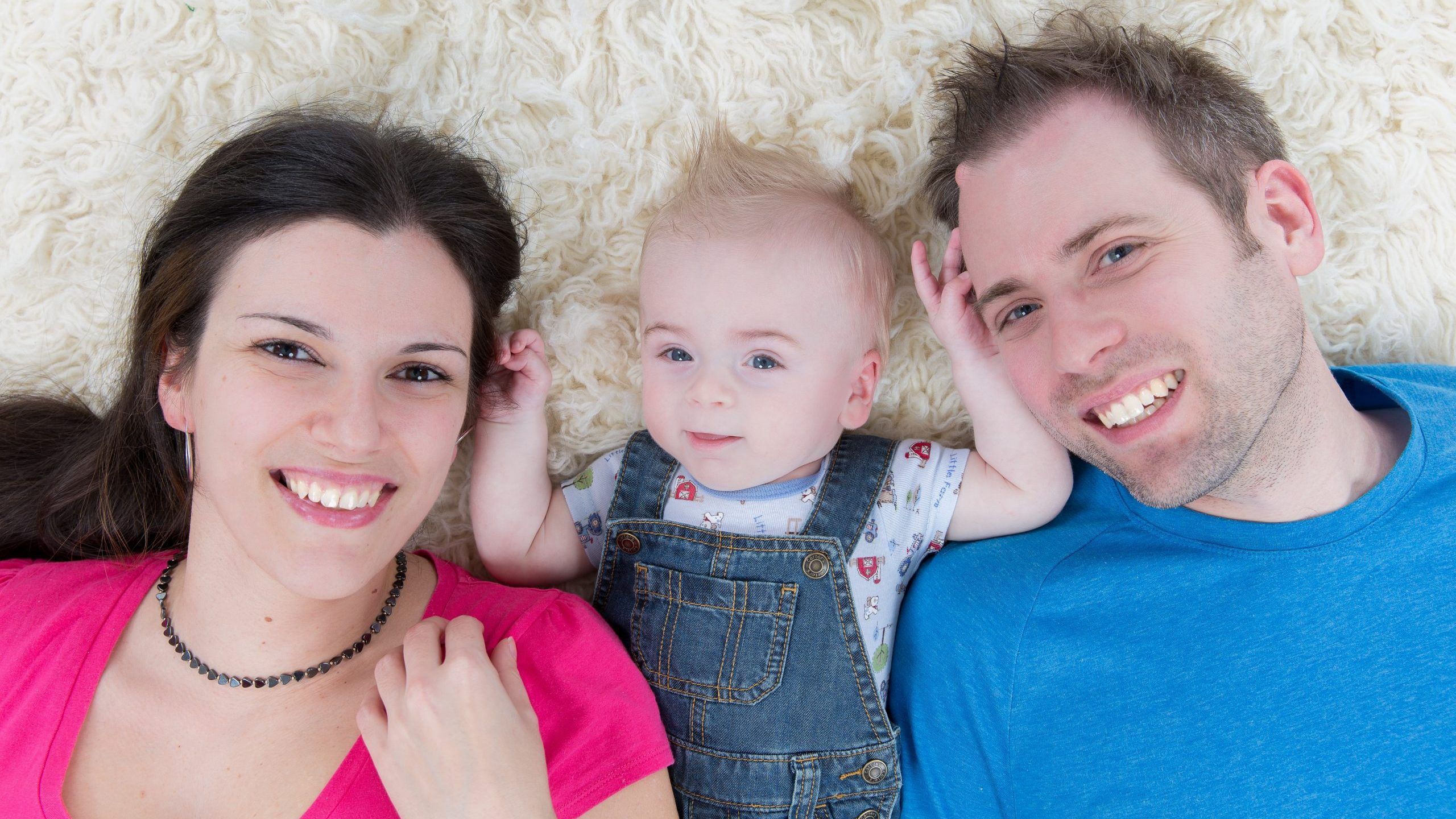 Alex Oliver, before his Hurler Syndrome diagnosis, with his father and mother, Caroline Marie Fidalgo. SUPPLIED