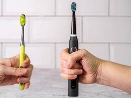 Electric and regular toothbrush in a bathroom. Dental care. Manual toothbrush against modern electric toothbrush concept.