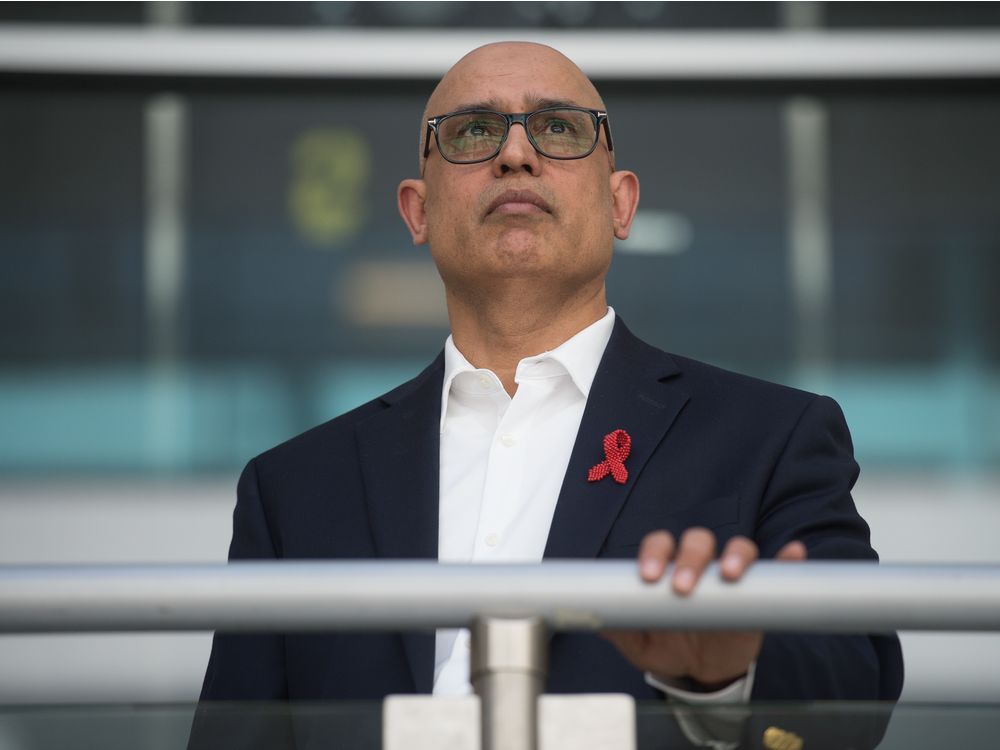 dr. ibrahim khan, a regional medical health officer for indigenous services canada, stands in the alvin hamilton building in regina.