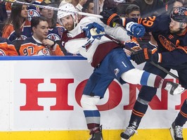 Colorado Avalanche's Devon Toews (7) is checked by Edmonton Oilers' Leon Draisaitl (29) during second period NHL conference finals action in Edmonton on Monday, June 6, 2022.