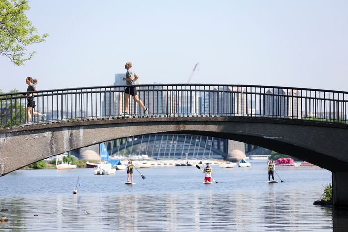 People exercise at The Charles River Esplanade as the U.S. East Coast is hit by a heat wave, in Boston, Mass. on May 22, 2022.