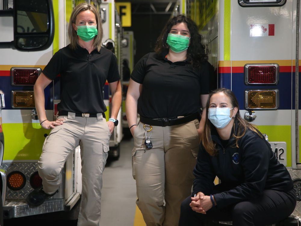 Acting Superintendent of the Ottawa Paramedic Service, Logan Martin, left, was the project lead on a new initiative called Mental Wellbeing Response Teams, which sees social worker/crisis counsellors such as Lauren McCusker, right, accompany other paramedics such as Megan Redmond, centre, on calls.