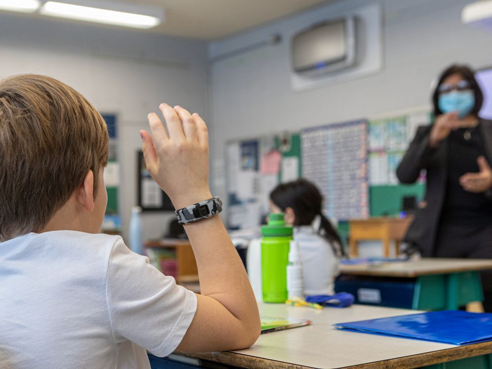 the emsb showed off their newly installed air purifiers at pierre elliott trudeau elementary school in montreal on monday january 11, 2021. the hepa filter hangs from the wall in the background while principal tanya alvarez takes over a class at the elementary school.