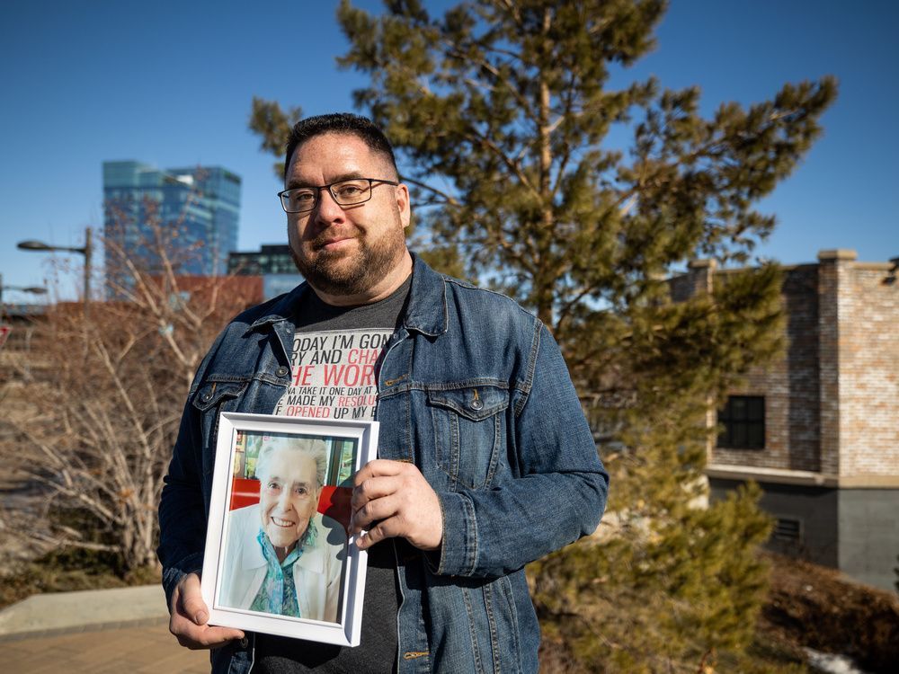 mike mcguire holds a photo of his mom lois. lois died at st. paul's hospital earlier this month after being hospitalized for what seemed like a routine health issue. photo taken in saskatoon, sk on friday, march 25, 2022.