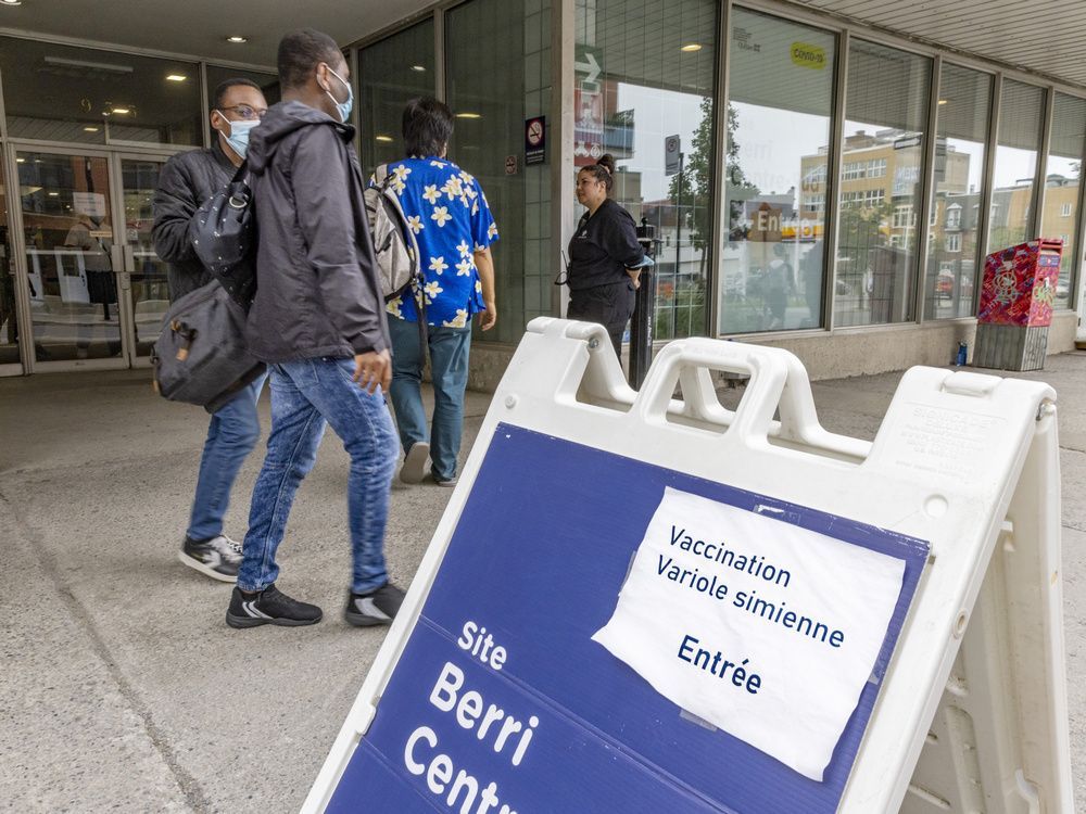 people pass the monkeypox vaccination clinc in montreal june 15, 2022.