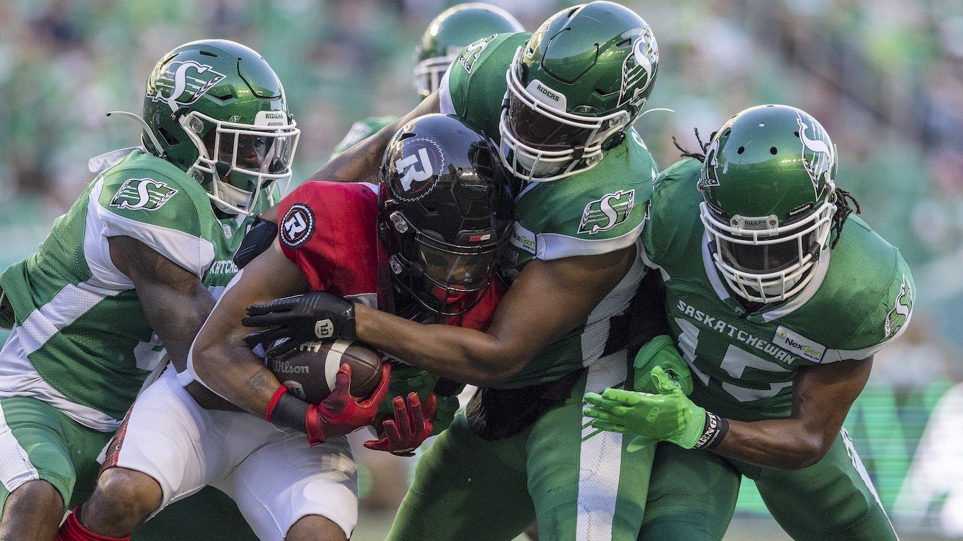 A trio of Saskatchewan Roughriders defenders tackle an Ottawa Redblacks player.
TROY FLEECE / Regina Leader-Post