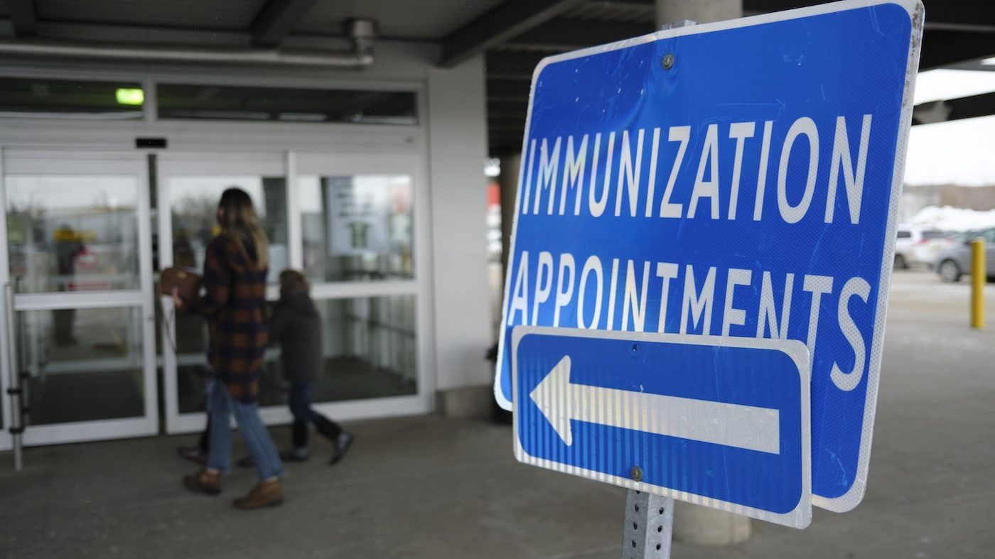 a family arrives for an appointment at a covid-19 immunization clinic. the canadian press/michael bell